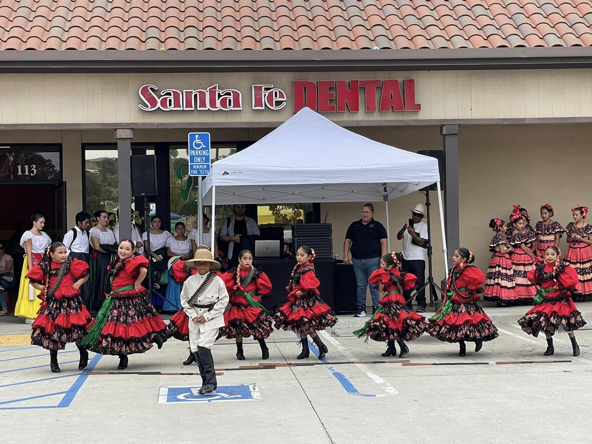 Folklorico dance group performing outside Santa Fe Dental Group