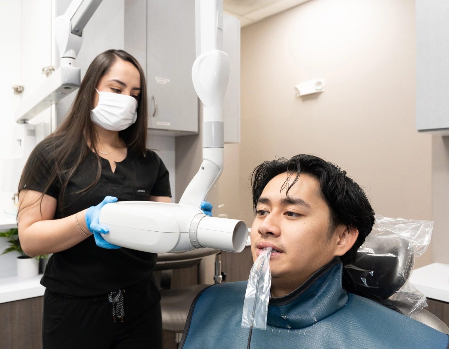 A dental team member assisting a patient at Santa Fe Dental Group